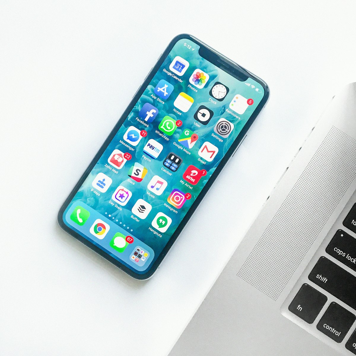 Modern smartphones on a desk representing the surge in mobile LPDDR5X component costs